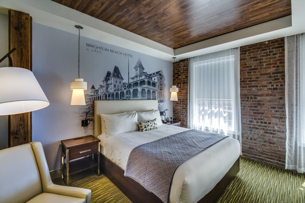 Beautiful Room Design with Brick Walls and Wood Ceilings at The Brooklyn Hotel